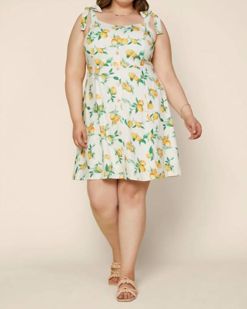 Front of a model wearing a size XXXL Curvy Lemon Print Dress In White And Yellow in White And Yellow by Skies are Blue. | dia_product_style_image_id:345235